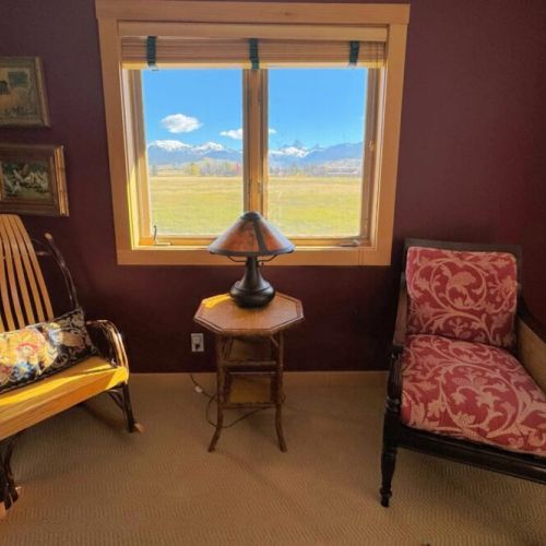 Bedroom #2 enjoys a queen bed, an en suite bath, and a lovely view of the Tetons.