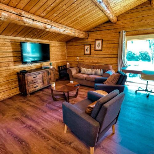 The loft apartment living area enjoys comfortable seating and a large smart TV.