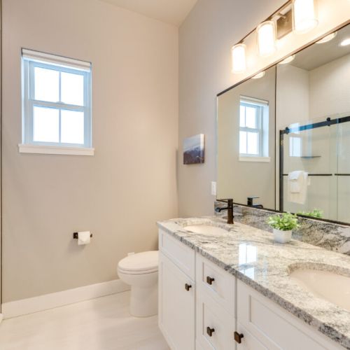 Bedrooms #2 and #3 share a full bathroom, which features a large vanity and a tub/shower combo.