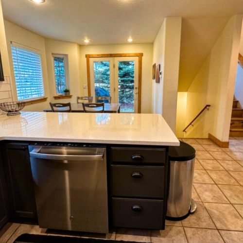 The dining area is connected to the kitchen, making meal prep and clean-up a breeze.