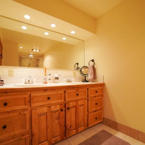 The basement enjoys a full bathroom, complete with a double vanity and a lovely walk-in shower.