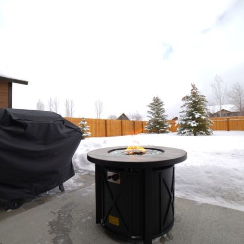 Head outside to enjoy the gas fire pit or cook a meal on the propane grill.