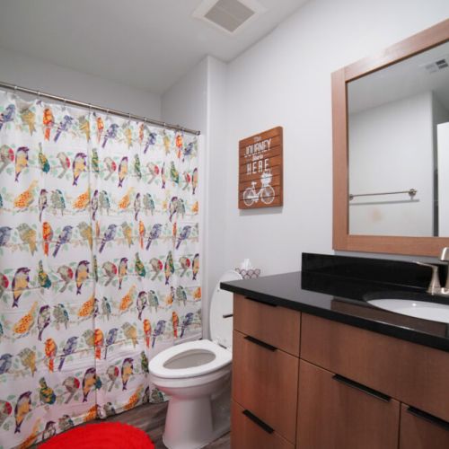Bedrooms #2 and 3 share a full bathroom, with a large tub/shower combo and a spacious vanity.
