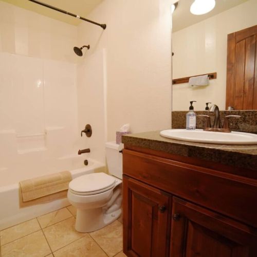 Bedrooms #2 and #3 share a bathroom with a large tub/shower.