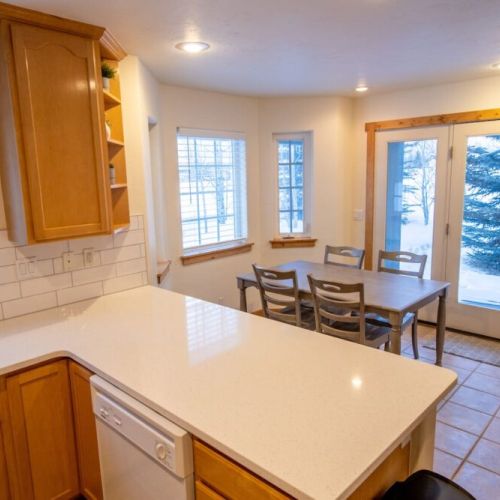 Gather around the dining table for food, conversation, or fun.