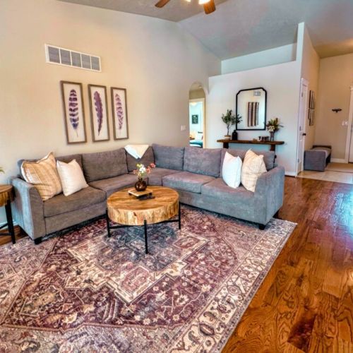 Relax in the living room after a day of play by lounging on the sofa in front of the gas fireplace or smart TV.
