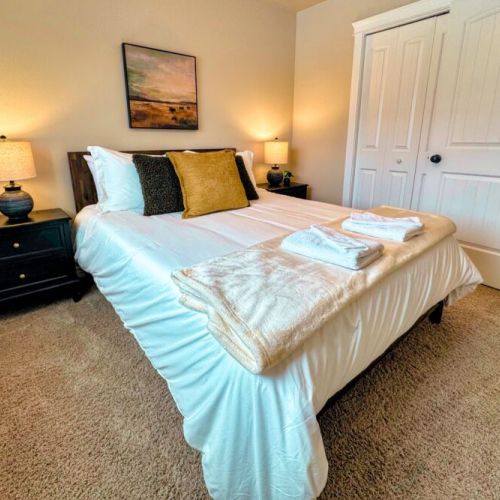 Bedroom #2 has a queen bed and a lovely view of the front yard.