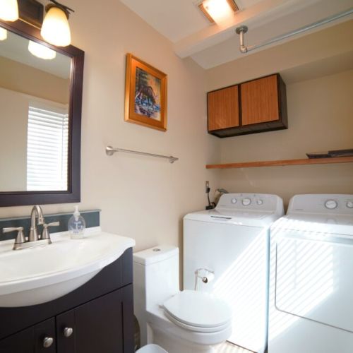 The downstairs has a powder room. And, in case your day of skiing or hiking has your clothes in need of cleaning, we have a washer and dryer on-site — we even provide detergent!