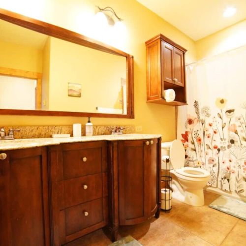 Bedrooms #2 and #3 share a bathroom, which has a double vanity and a large tub/shower combo.