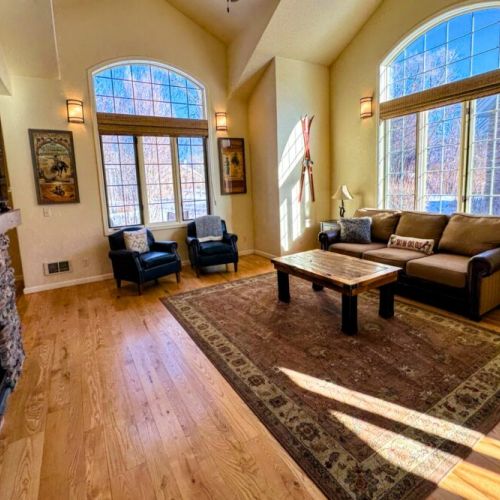 Kick back and relax in the living room, taking advantage of the inviting seating and a large smart TV.