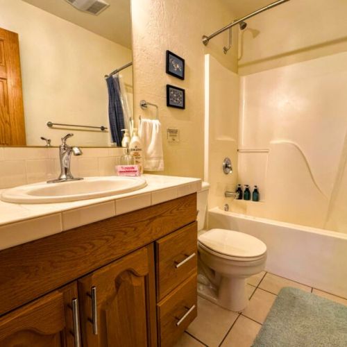 Bedroom #2 makes use of the upstairs hallway bathroom, which also enjoys a vanity and tub/shower combo.