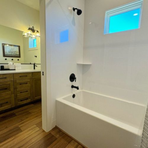 Another full bathroom can be found upstairs with a large double vanity and a pocket door for privacy when using the tub/shower or the toilet.