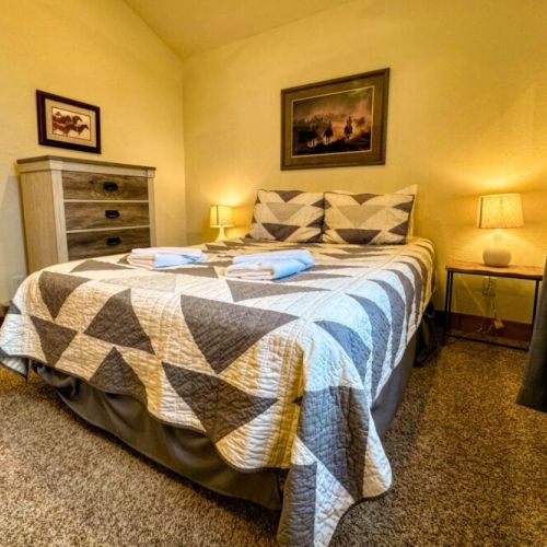 Bedroom #2 has a queen bed, and also enjoys a dresser and a large closet.