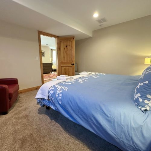 Bedroom #3, located at the far end of the basement, has a king bed.