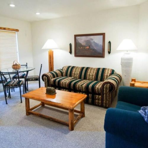 Second floor living area with pullout couch and its own dining table, too!
