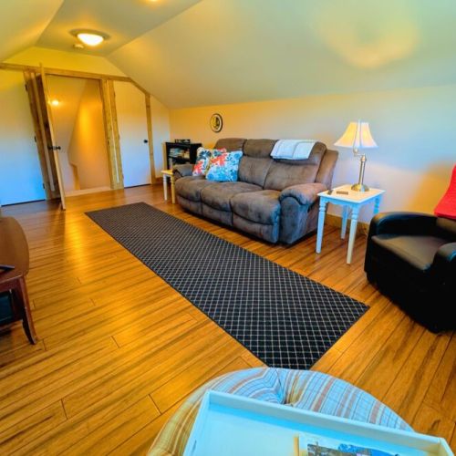 Over the garage is a separate living area — perfect for kids or those in need of a little getaway!