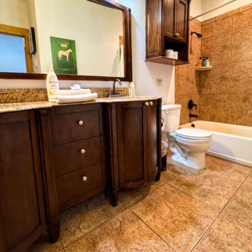 Bedrooms #2 and #3 share a bathroom, which has a double vanity and a large tub/shower combo.