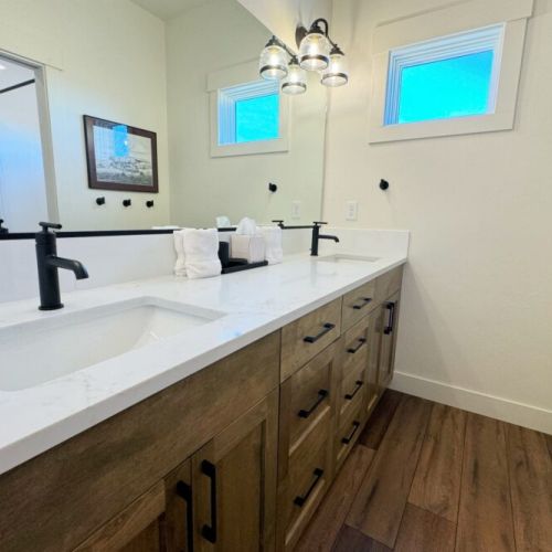 Another full bathroom can be found upstairs with a large double vanity and a pocket door for privacy when using the tub/shower or the toilet.