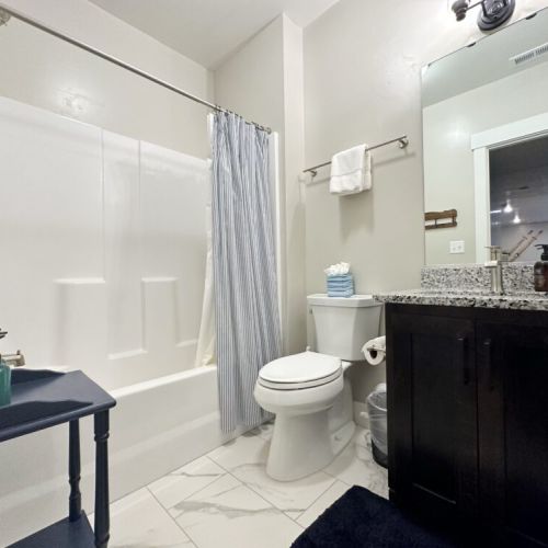 The basement enjoys a full bath, with a vanity and tub/shower combo.