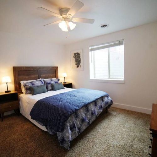Bedroom #4, located in the basement, has a queen bed and closet.