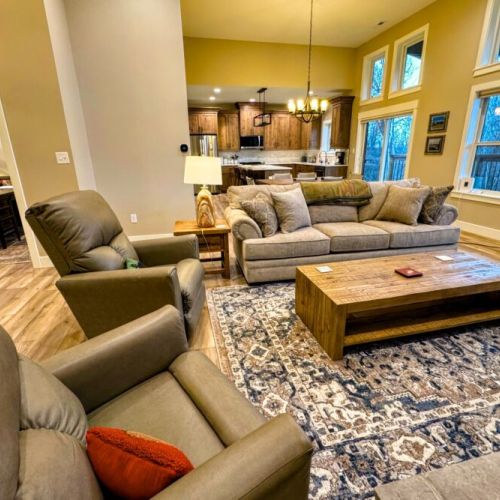 Relax in the living room after a day of play by lounging on the sofa or recliners in front of the gas fireplace or smart TV.