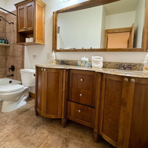 Bedrooms #2 and #3 share a bathroom, which has a double vanity and a large tub/shower combo.