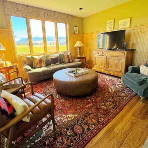 Kick back and relax in the living room, taking advantage of the cozy seating and a large TV.