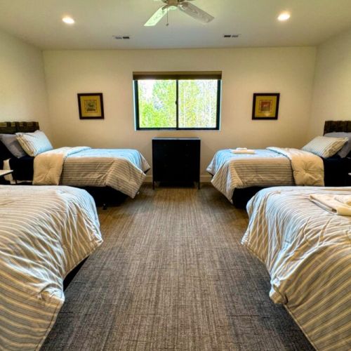 Bedroom #5 (upstairs) comes with 4 twin beds — perfect for kids! The room also enjoys an en suite.