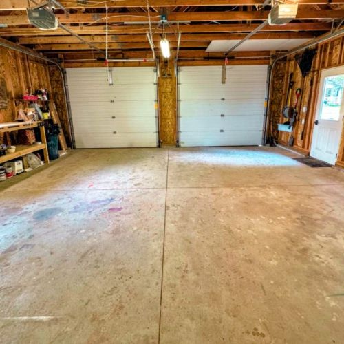 Keep your vehicle and gear dry in this 2-stall garage!