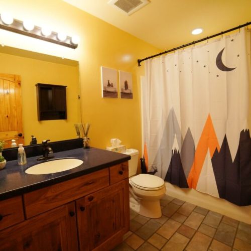Nestled between Bedrooms #2 and #3 is  a bathroom with a large tub/shower.