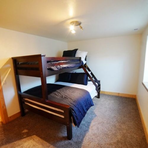 Bedroom #5 in the lower level also has a twin-over-queen bunk bed and plenty of storage space.