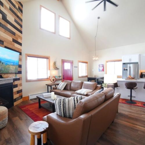 Whether you are relaxing in the living room, eating at the dining room table, or hanging in the kitchen, you are always a part of the fun in this home.