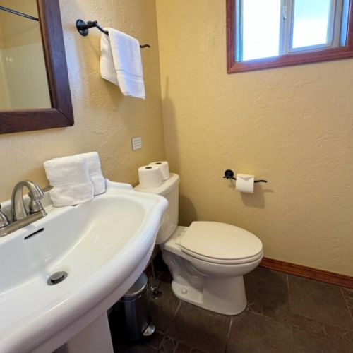 Downstairs also enjoys a full bathroom, with large tub/shower combo.