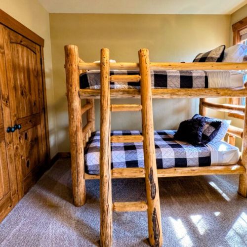 Bedroom #3 features a handmade twin-over-twin pine bunkbed — perfect for kids!