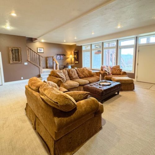 The downstairs living area has plenty of cozy seating and a smart TV.