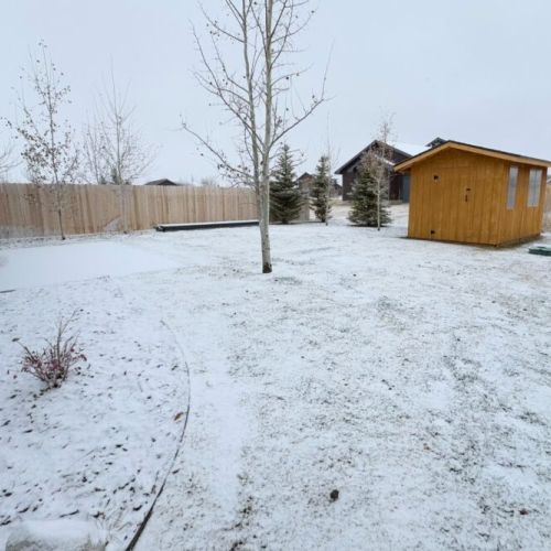 The spacious backyard offers plenty of space for the kids to play out in the fresh mountain air.