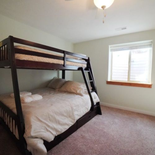 Bedroom #5 (located in the basement) has a twin-over-full bunk bed.