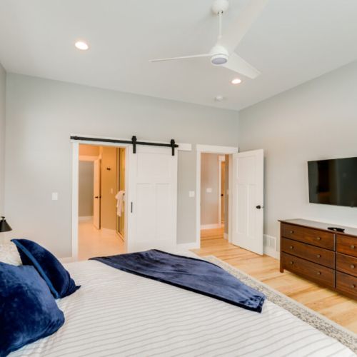 The primary bedroom features a king bed and a large en suite bathroom.