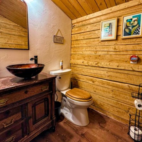 The loft apartment bathroom has a walk-in shower to go with its rustic charms.