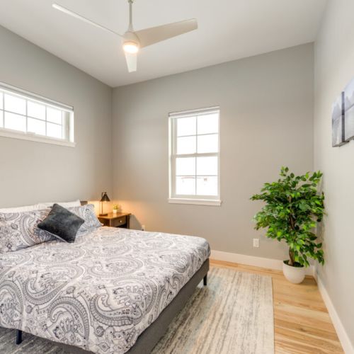 Bedroom #2 has a queen bed, beautiful natural light, and a closet for storing your belongings.