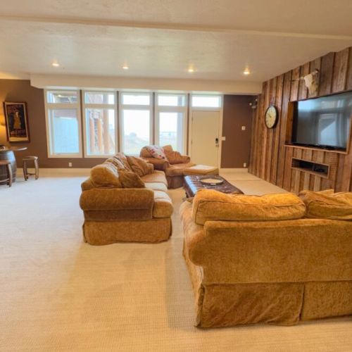 This is the perfect space to enjoy a family movie night or a relaxing day at home.