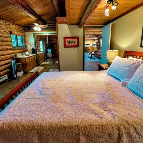 The primary bedroom (located on the ground level) has a queen bed and attached bath amenties.