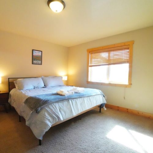 Bedroom #2 (located on the main level) has a king bed and ample storage space.
