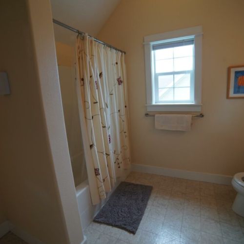 Upper bathroom has a combo shower tub and plenty of room for everyone.