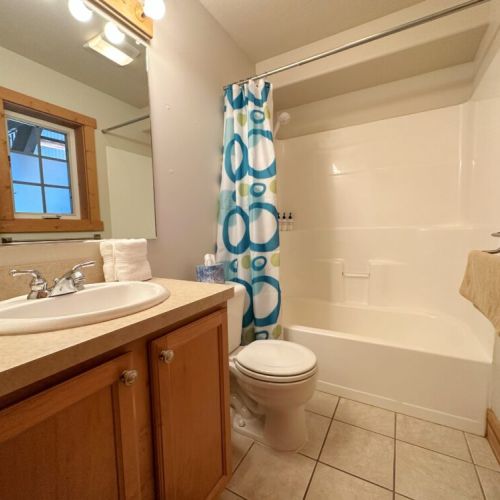 The downstairs bathroom has a large tub/shower combo and a great mirror for beginning or ending your day.