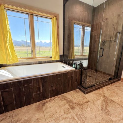 The huge en suite bath has a spacious double vanity, as well as a walk-in shower and tub.