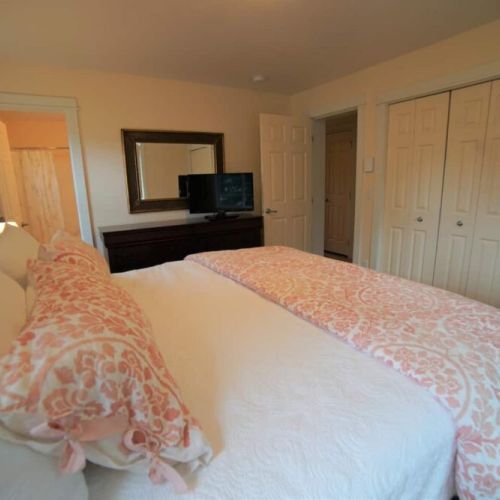 Master suite with king bed and attached bathroom.