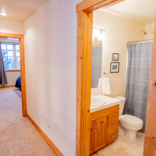 The upstairs bathroom is located between the master bedroom and bedroom #2.