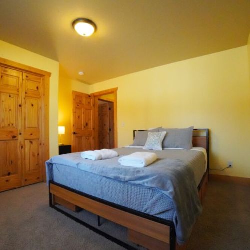 Bedroom #3 (located on the main level) has a queen bed and great natural light.