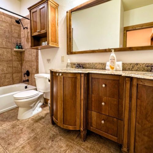 Bedrooms #2 and #3 share a bathroom, which has a double vanity and a large tub/shower combo.